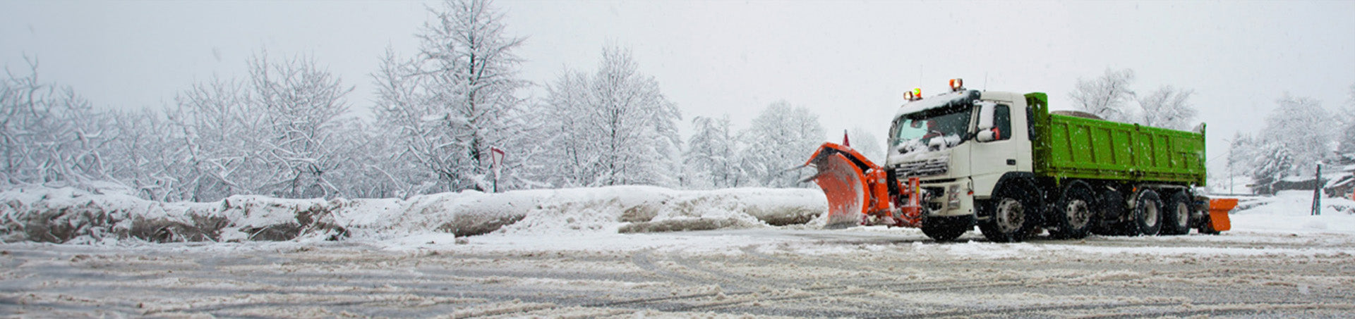 Truck with snow scraper