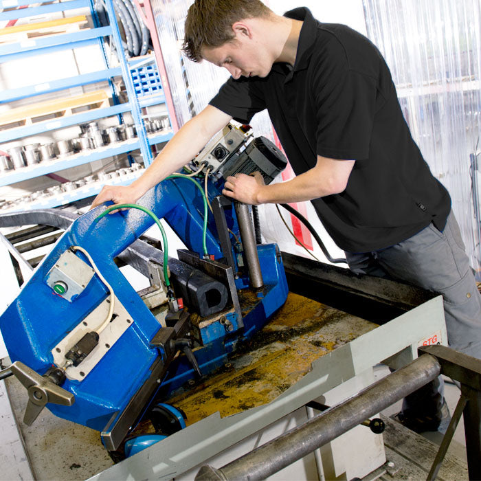 Guy making rubber bumper blocks